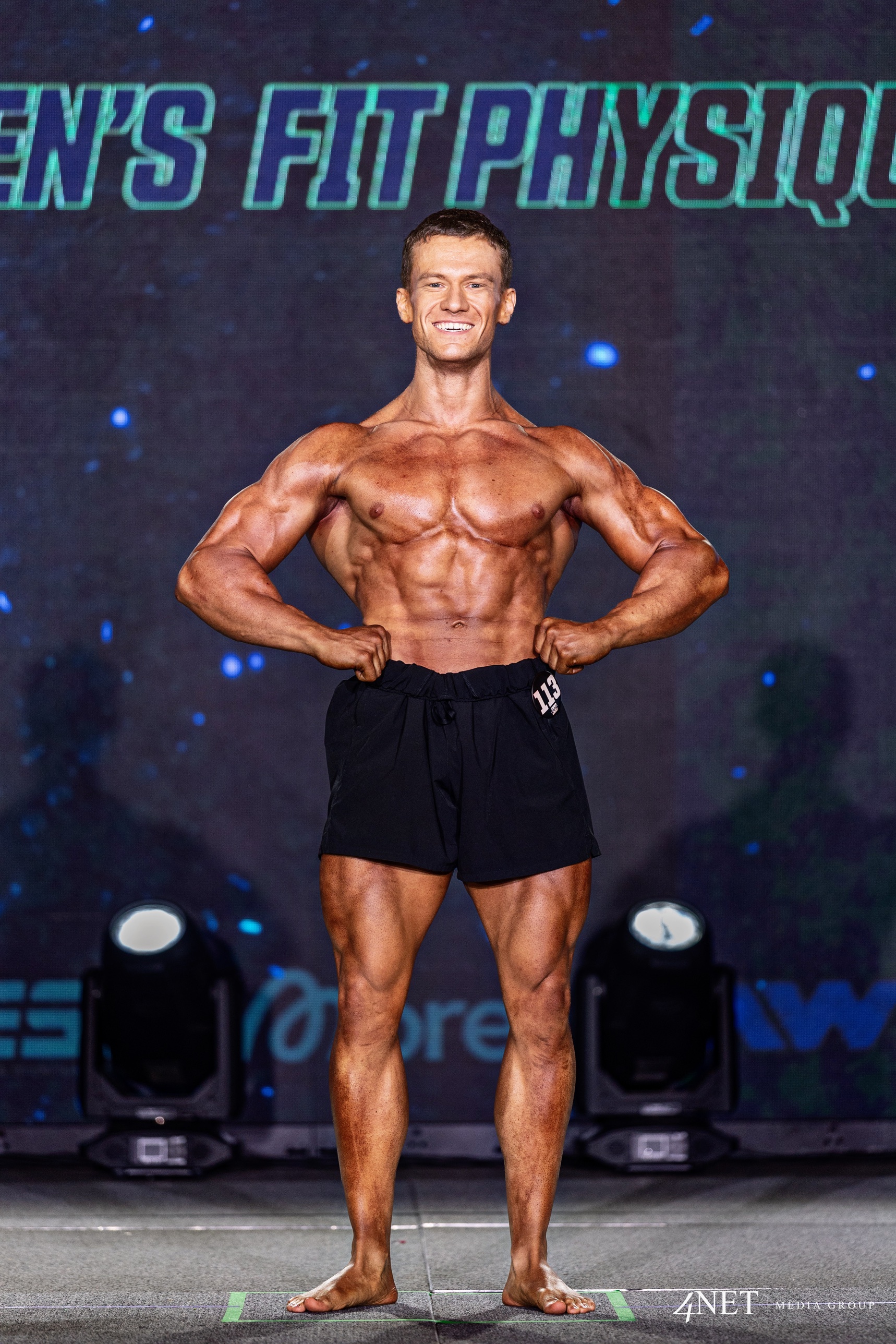 Cameron Kennison smiling on stage at Summer Shredding Houston.